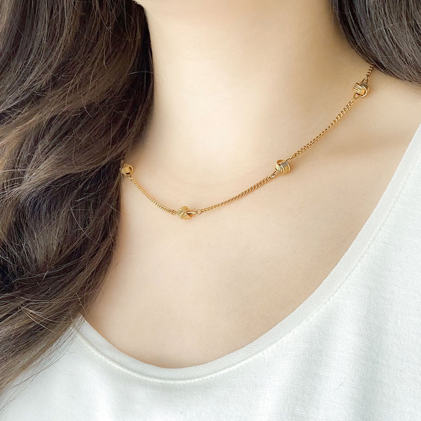 BRENTON vintage gold tone metal love knot necklace