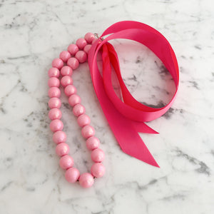 DELORES bright pink opalescent pearl ribbon tie necklace - 