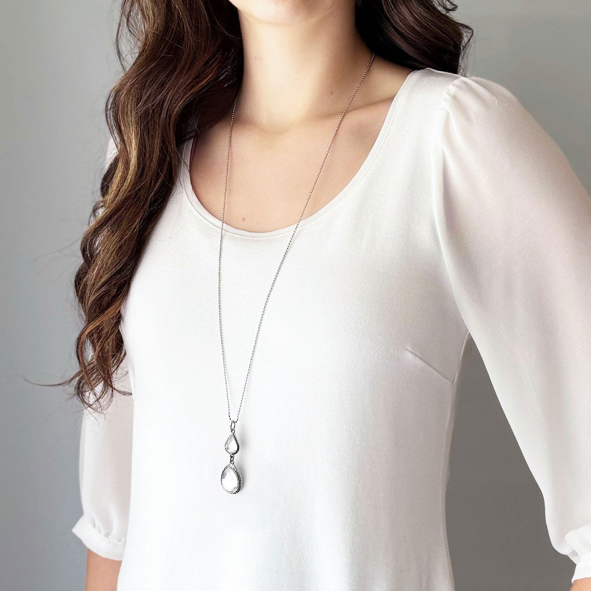 Vintage tiered necklace with two clear faceted rhinestone pendants on a silver-tone ball chain